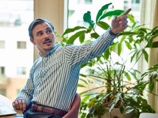 Man pointing to something at a workshop