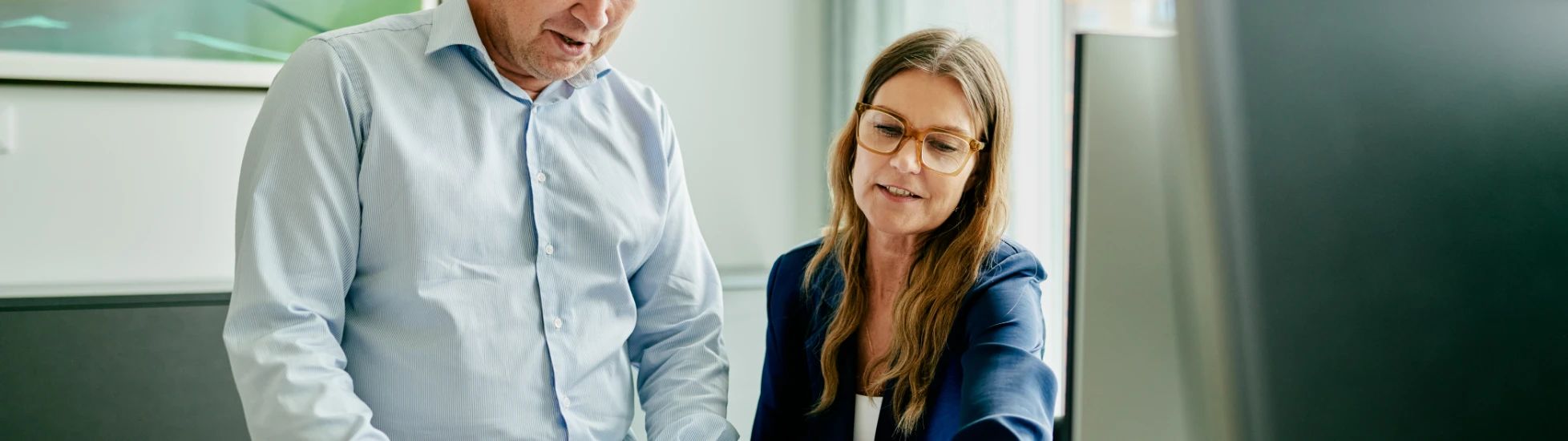 Colleagues discussing report