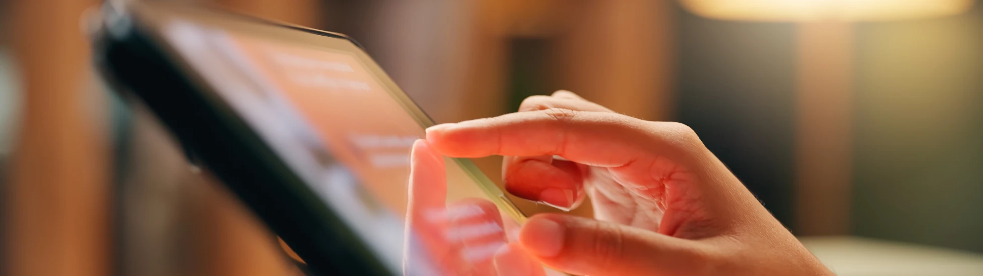 Hand touching tablet