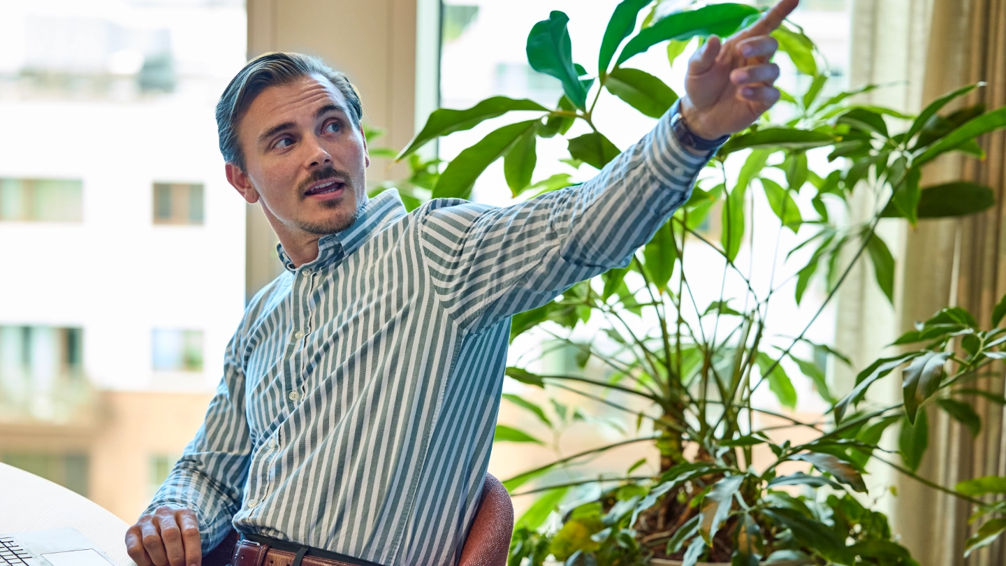 Man pointing to something at a workshop