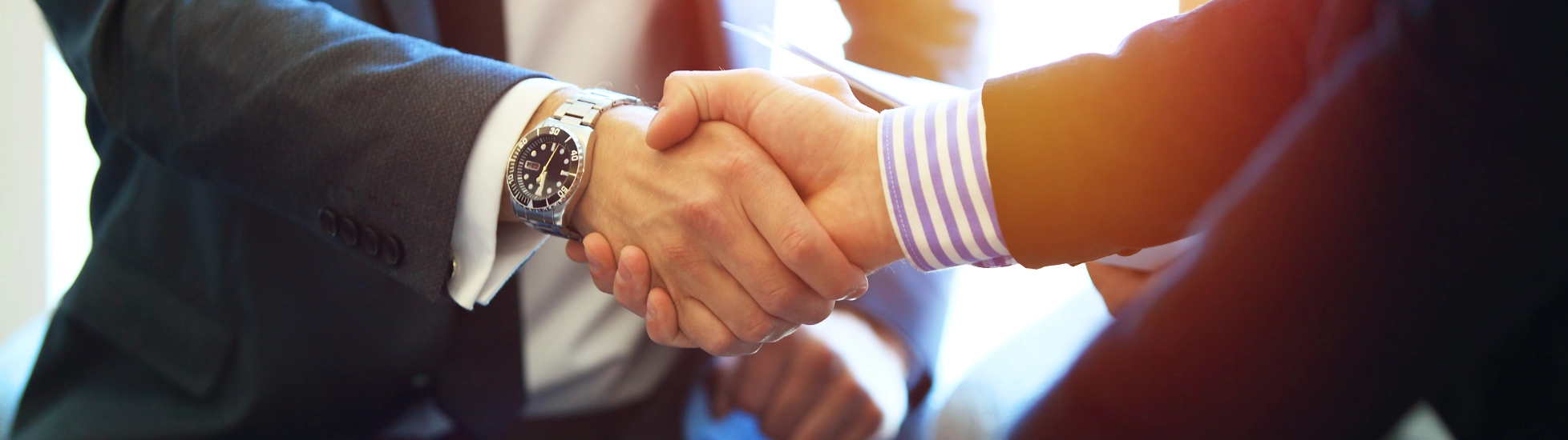 business people shaking hands finishing up a meeting