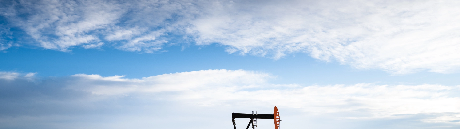 Industrial oil pump on farm land